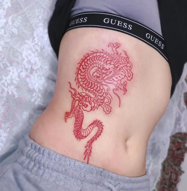 Red dragon rib tattoo