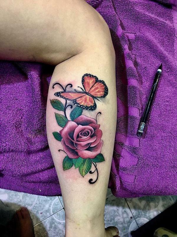 Rose and butterfly calf tattoo