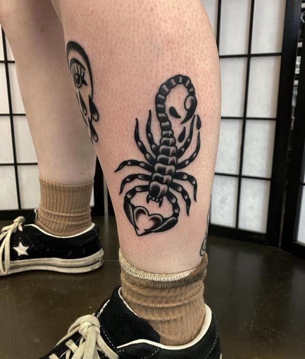 Scorpion holding a love symbol