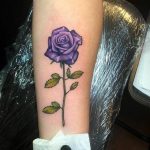 Single purple rose with stem tattoo