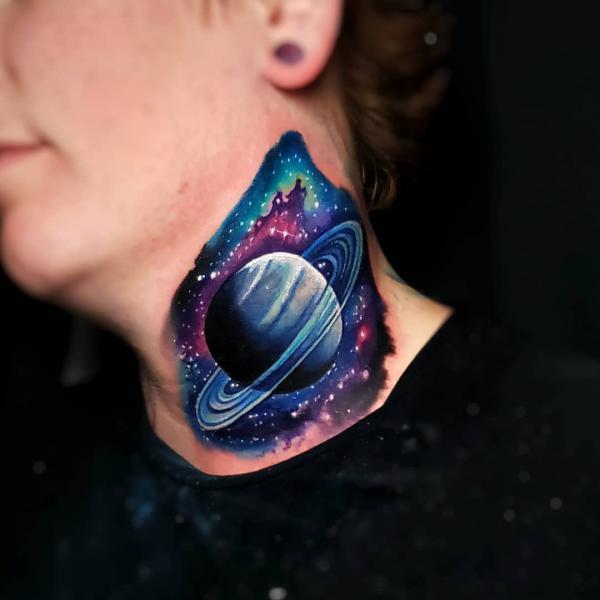 Spinning planet and galaxy neck tattoo