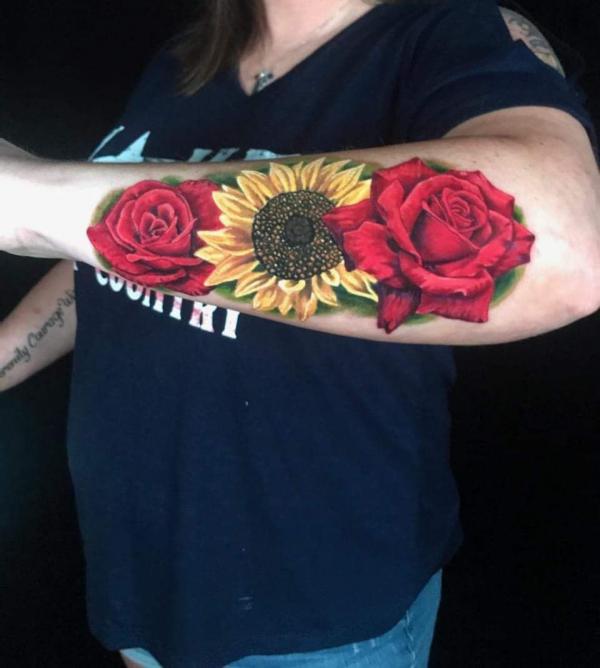 Sunflower and rose forearm tattoo