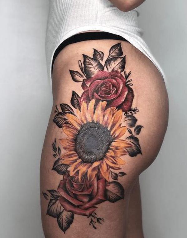 Sunflower and roses hip tattoo