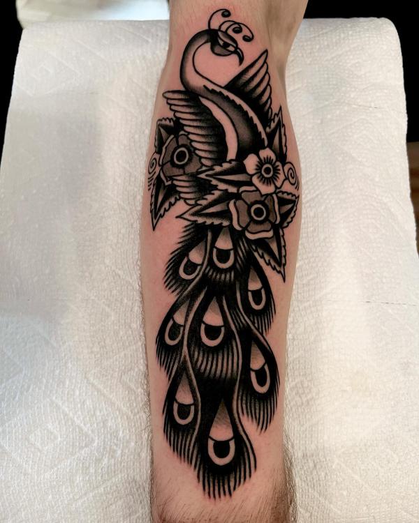 Traditional black and white peacock tattoo