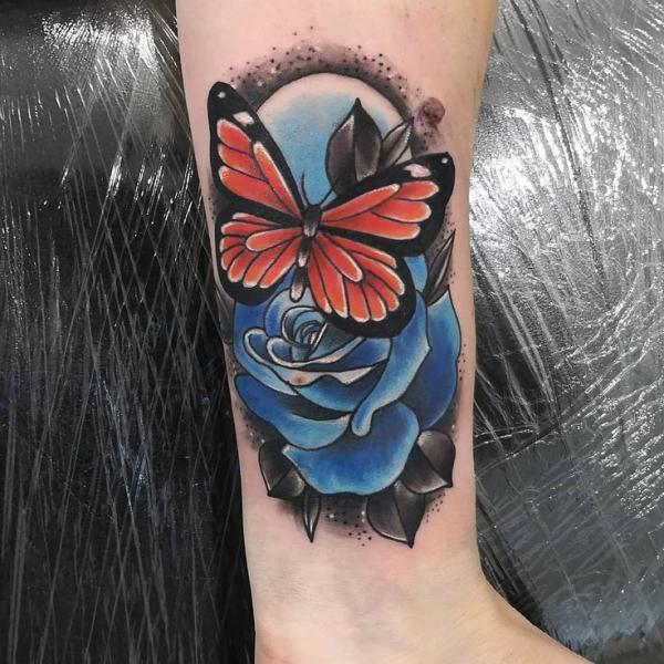 Traditional blue rose and butterfly tattoo