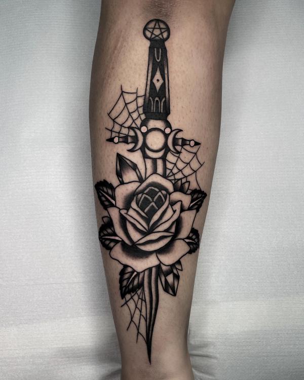 Traditional rose tattoo with dagger and spider web