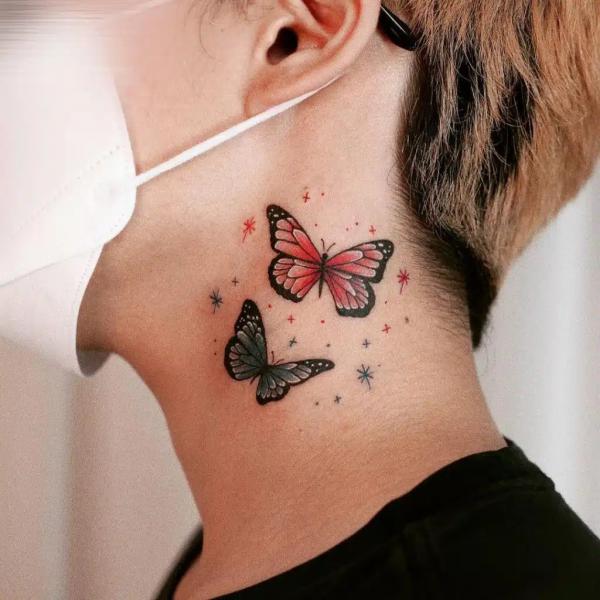Two butterfly side neck tattoo
