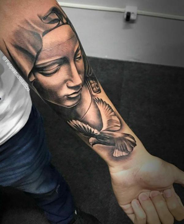 Virgin Mary and dove forearm tattoo