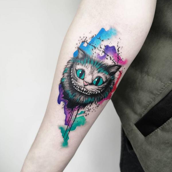 Watercolor Cheshire Cat forearm tattoo