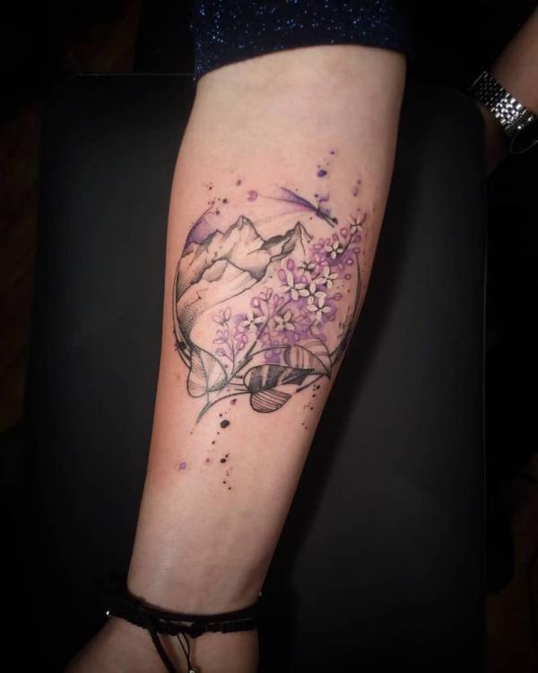 Watercolor lilac and mountain range tattoo