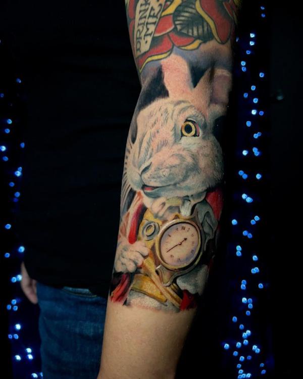 White rabbit inner forearm tattoo