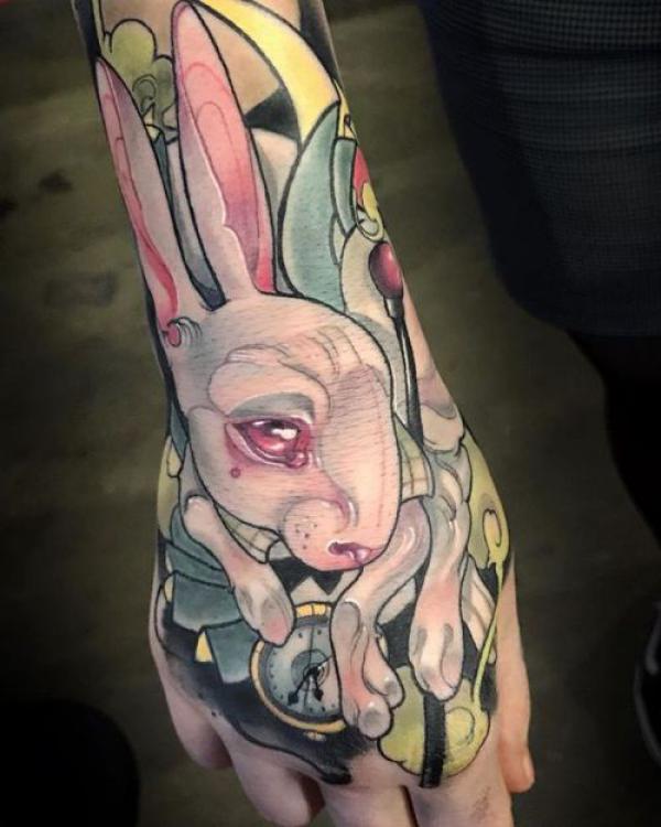 white rabbit hand tattoo