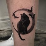 A black cat resting on crescent moon with flying bats