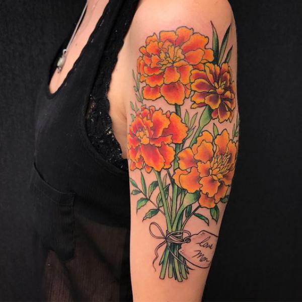A bouquet of marigold tattoo with name