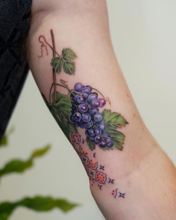 A bunch of grapes bicep tattoo