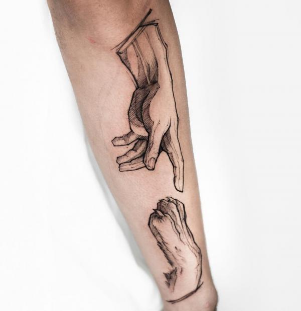 A hand pointing to a dog claw