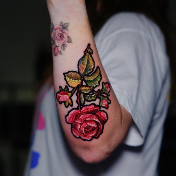 A stem of rose patch tattoo