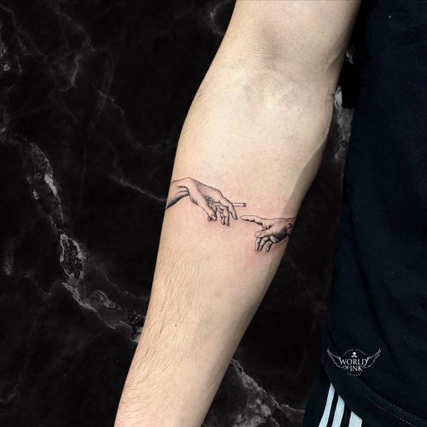 Adam hand with a cigarette tattoo