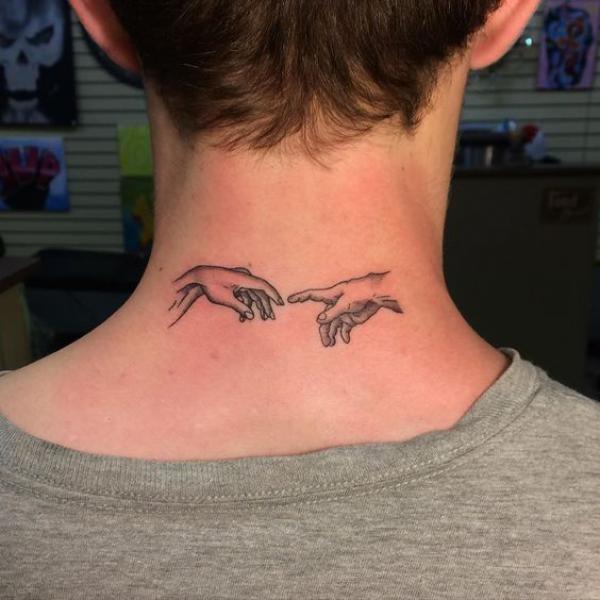 Adam hands neck tattoo