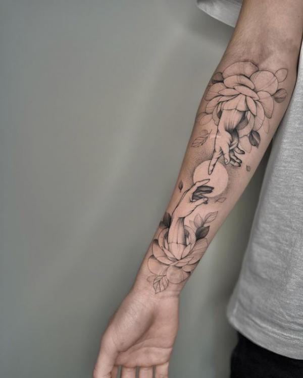 Adam hands with peony flowers and sun