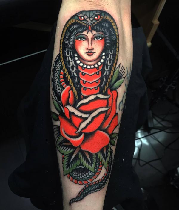 American traditional cobra tattoo with lady face and red rose tattoo