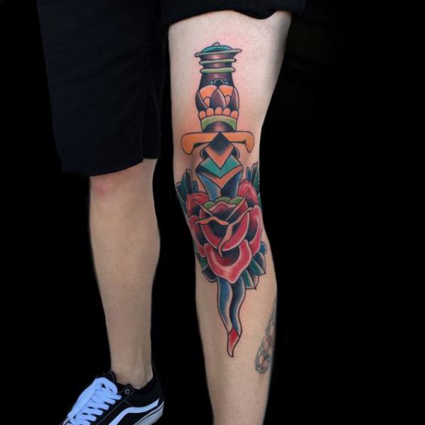 American traditional dagger and rose knee tattoo