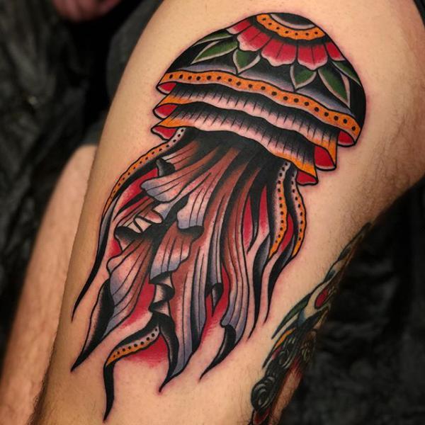 American traditional thigh tattoo