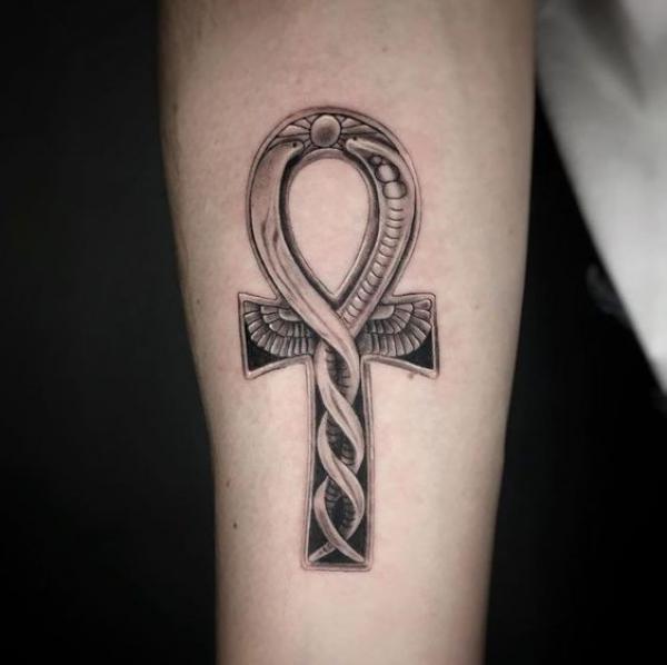 Ankh symbol with wings and entwined snakes