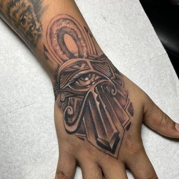 Ankh with eye hand tattoo