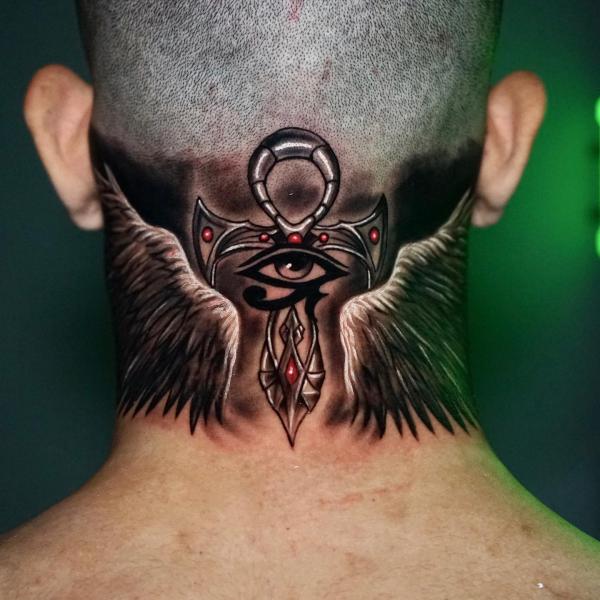 Ankh with eye of Ra and wings tattoo on the back of head