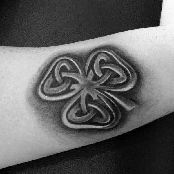 Black and grey 3D celtic shamrock tattoo