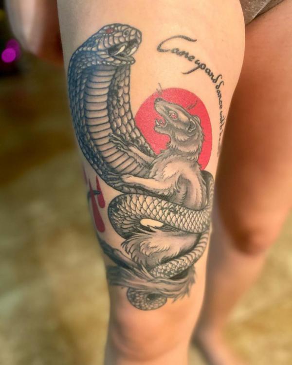 Black and grey Mongoose and cobra with sun tattoo