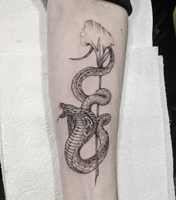 Black and grey cobra and calla lily tattoo