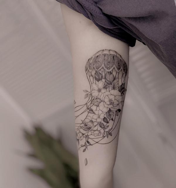 Black and grey floral jellyfish tattoo