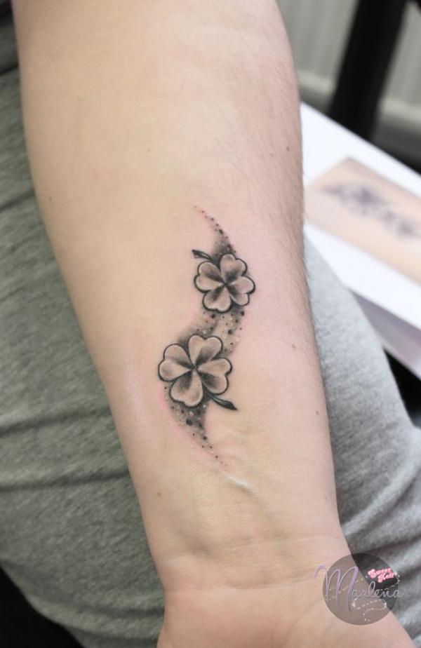 Black and grey four leaf clover tattoo