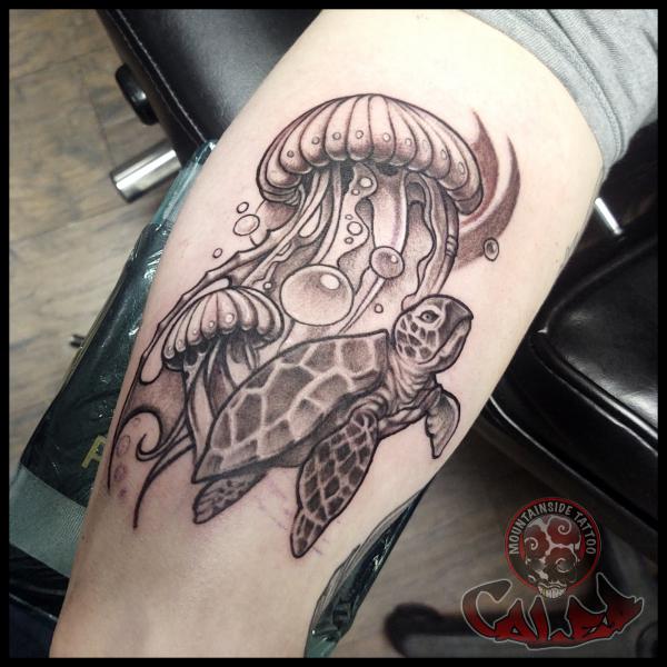 Black and grey jellyfish and turtle tattoo