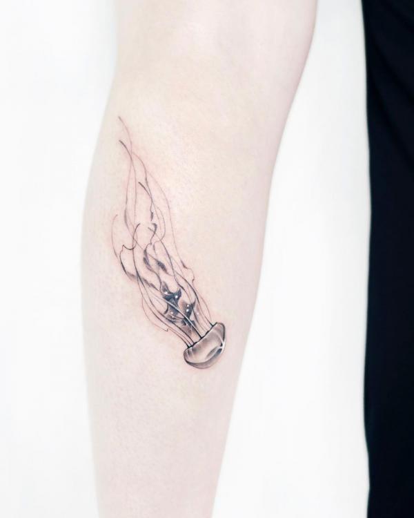 Black and grey jellyfish tattoo feminine style