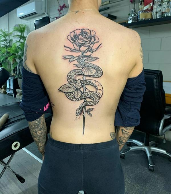 Black and grey rose and snake tattoo on back
