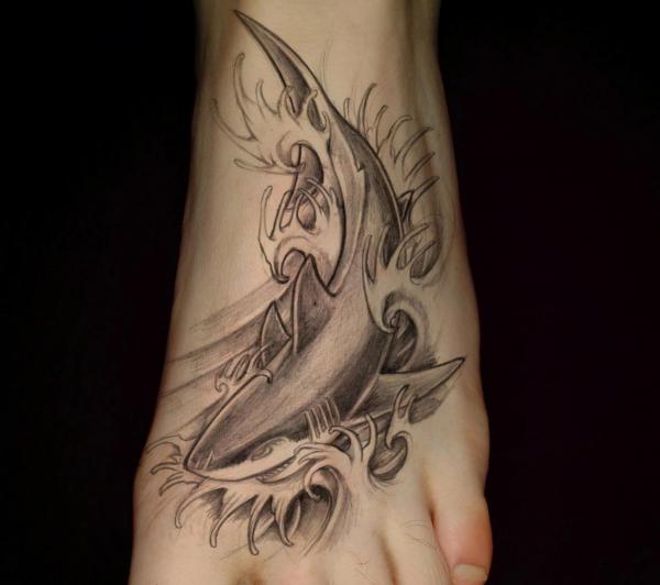 Black and grey shark in wave foot tattoo