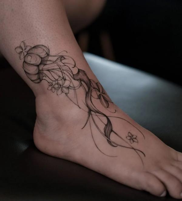 Black and white Jellyfish ankle tattoo