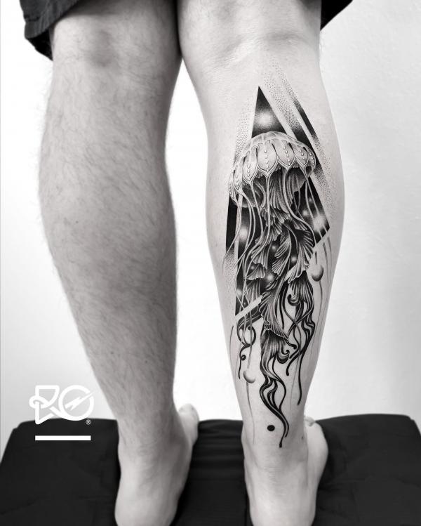 Black and white Jellyfish calf tattoo