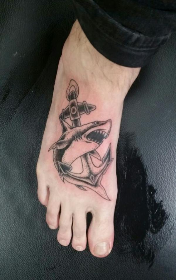 Black and white shark and anchor foot tattoo