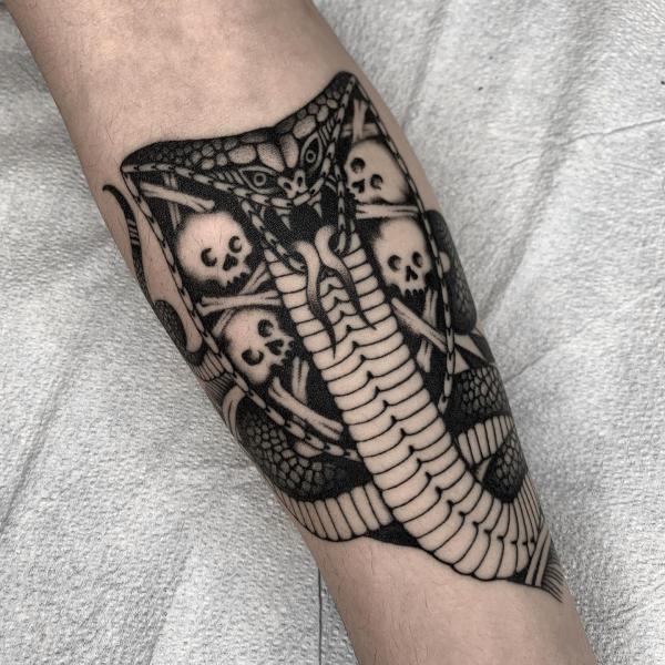 Black and white skull cobra head tattoo