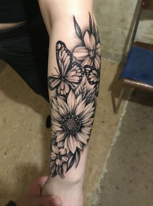 Black and white sunflower and butterfly tattoo