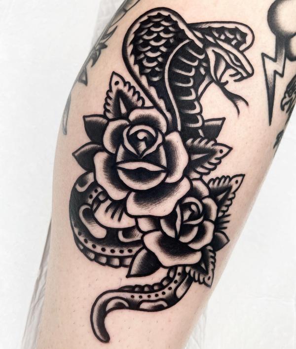 Black and white traditional cobra and rose tattoo