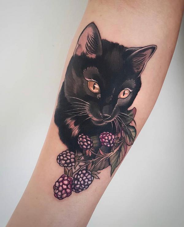 Black cat and purple berry