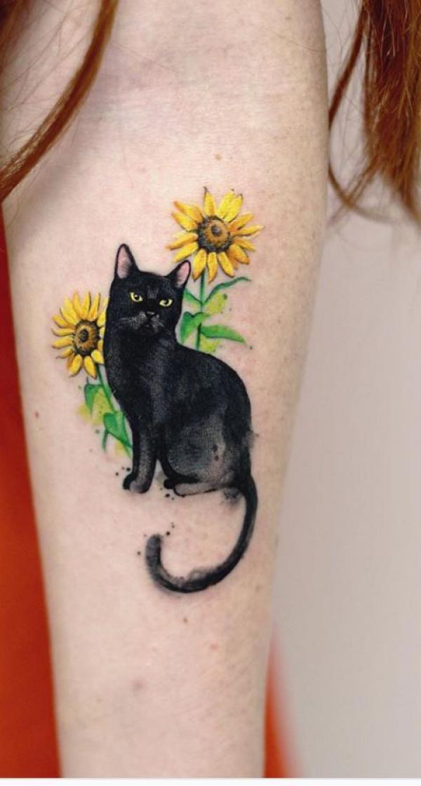 Black cat and sunflower tattoo