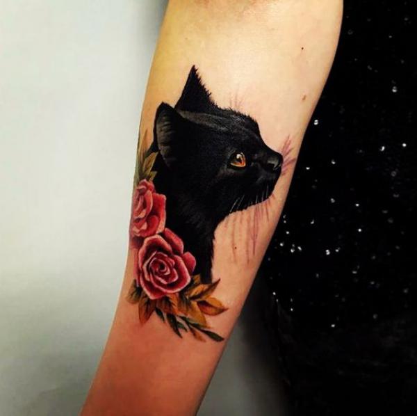 Black cat and traditional rose tattoo