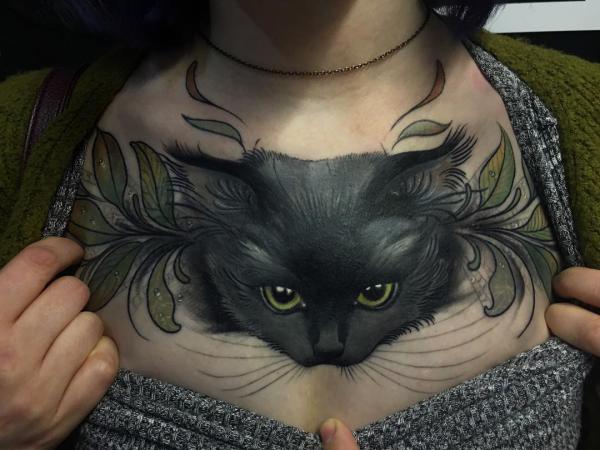 Black cat chest tattoo
