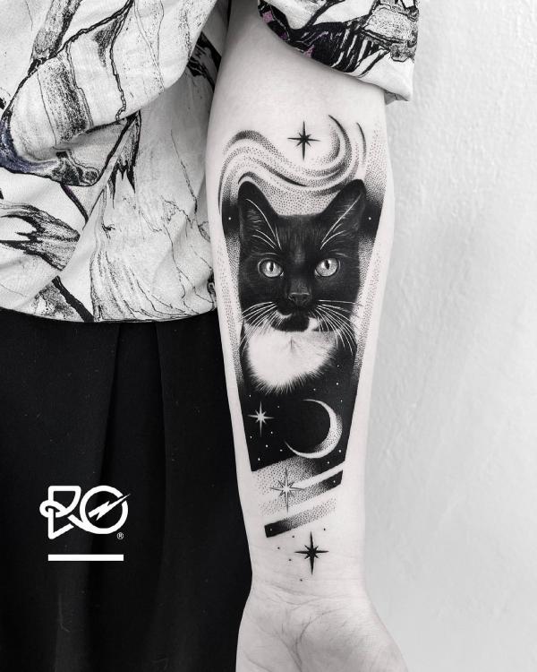 Black cat forearm tattoo